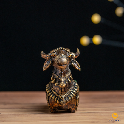 Dhokra Nandi, the sacred bull, is intricately detailed using the ancient Dhokra technique—a method of non-ferrous metal casting practiced for centuries. The result is a stunning candle holder that not only radiates warm, flickering light but also pays homage to Indian heritage.