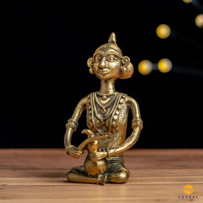 The intricate details in this brass tribal figure of working Madin tell a story of their unique way of life, Crafted by skilled tribal artisans.